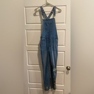 Jean overalls with stitched flowers on the end!